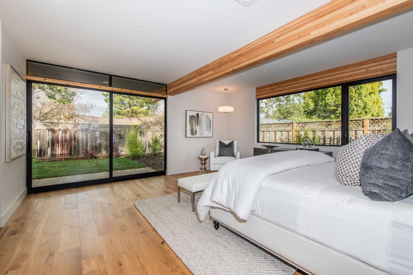 667 Springer Terrace Los Altos, CA 94024 - Photo 21 of 36 a bedroom with a large bed and a large window