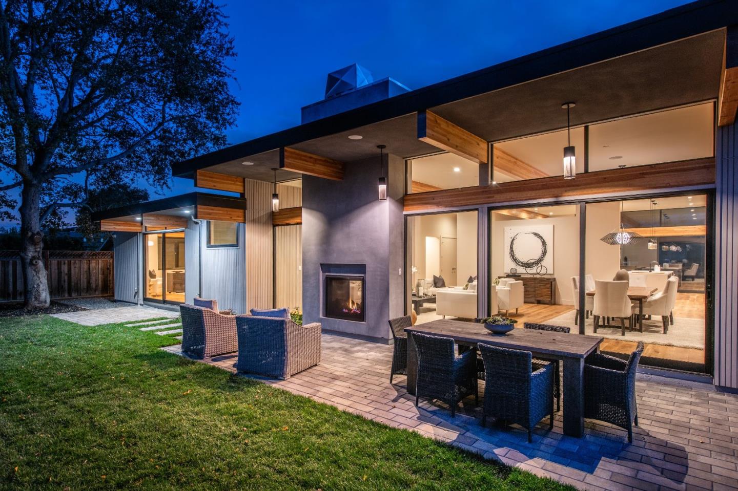 667 Springer Terrace Los Altos, CA 94024 - Photo 30 of 36 a living room with couches a dining table and chairs with outer view