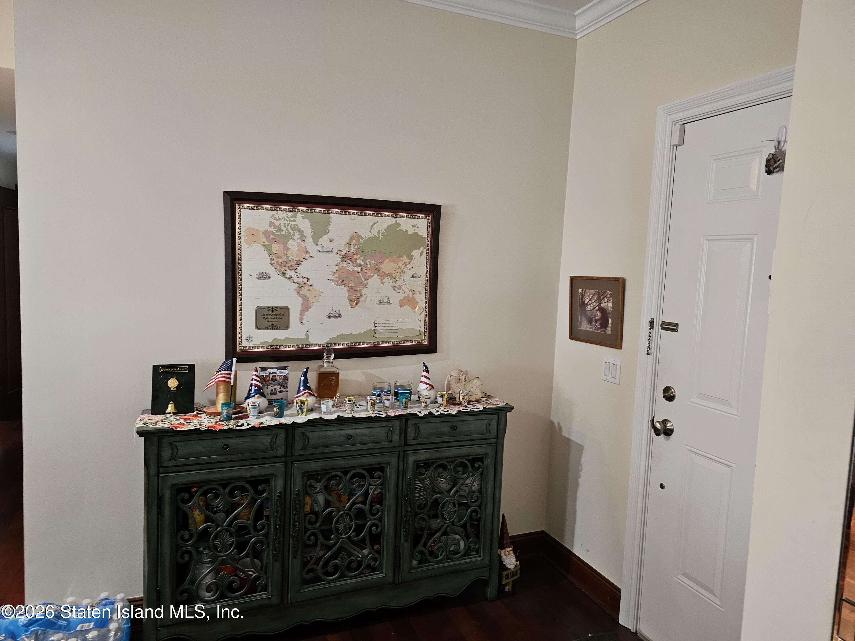 3871 Amboy Road, Unit 404 Staten Island, NY 10308 - Photo 3 of 17 a room with furniture and paintings on wall