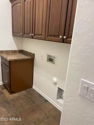 a view of a storage and utility room in a house