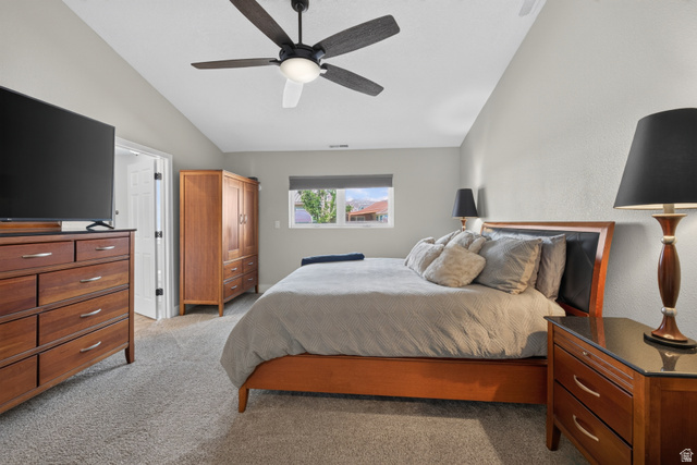 4297 Beeman Road Moab, UT 84532 - Photo 17 of 59 Carpeted room featuring a ceiling fan with integrated lighting, a window with a roller shade, and light gray painted walls