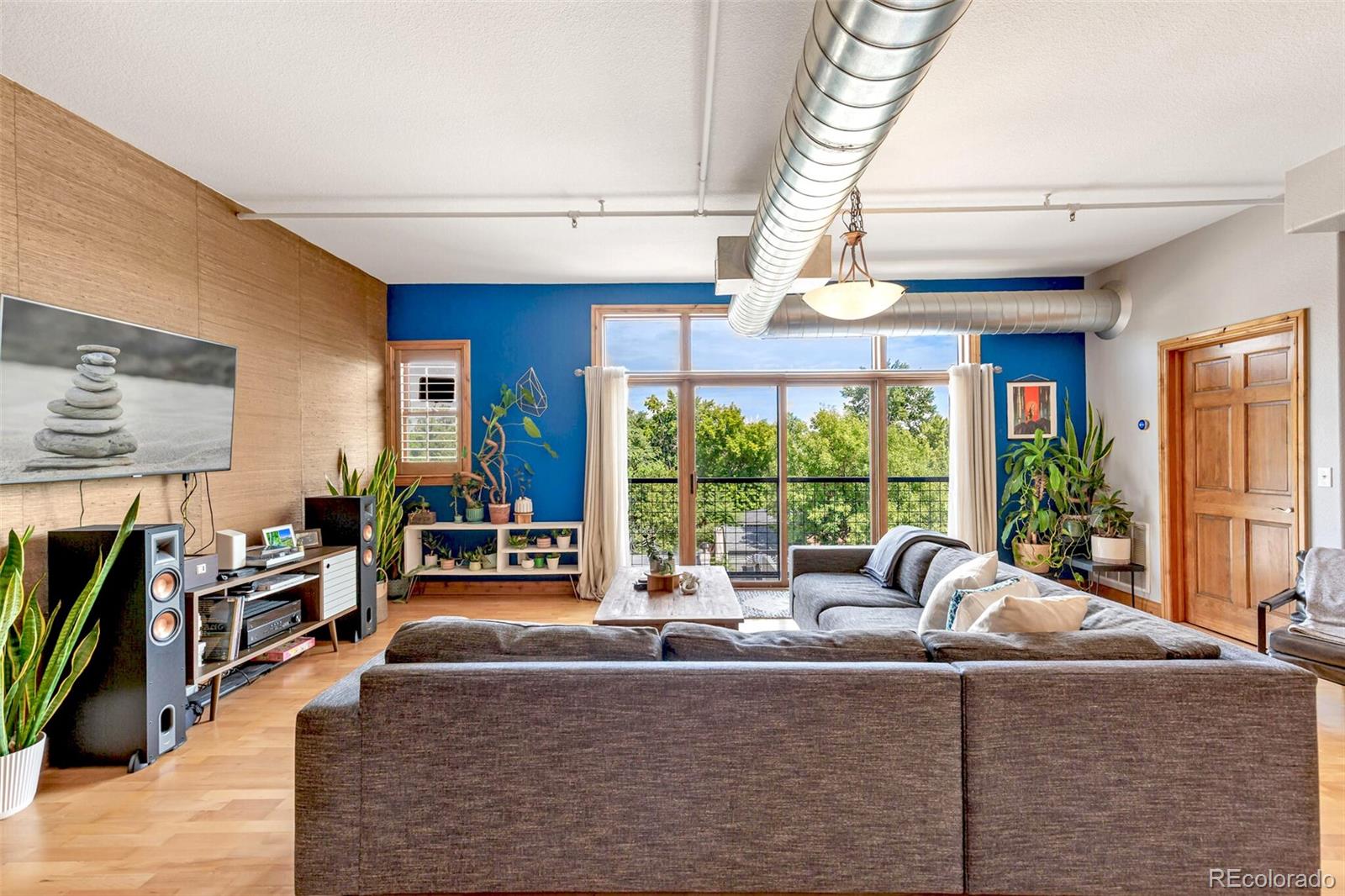 3299 Lowell Boulevard, Unit 302 Denver, CO 80211 - Photo 12 of 50 a living room with large window