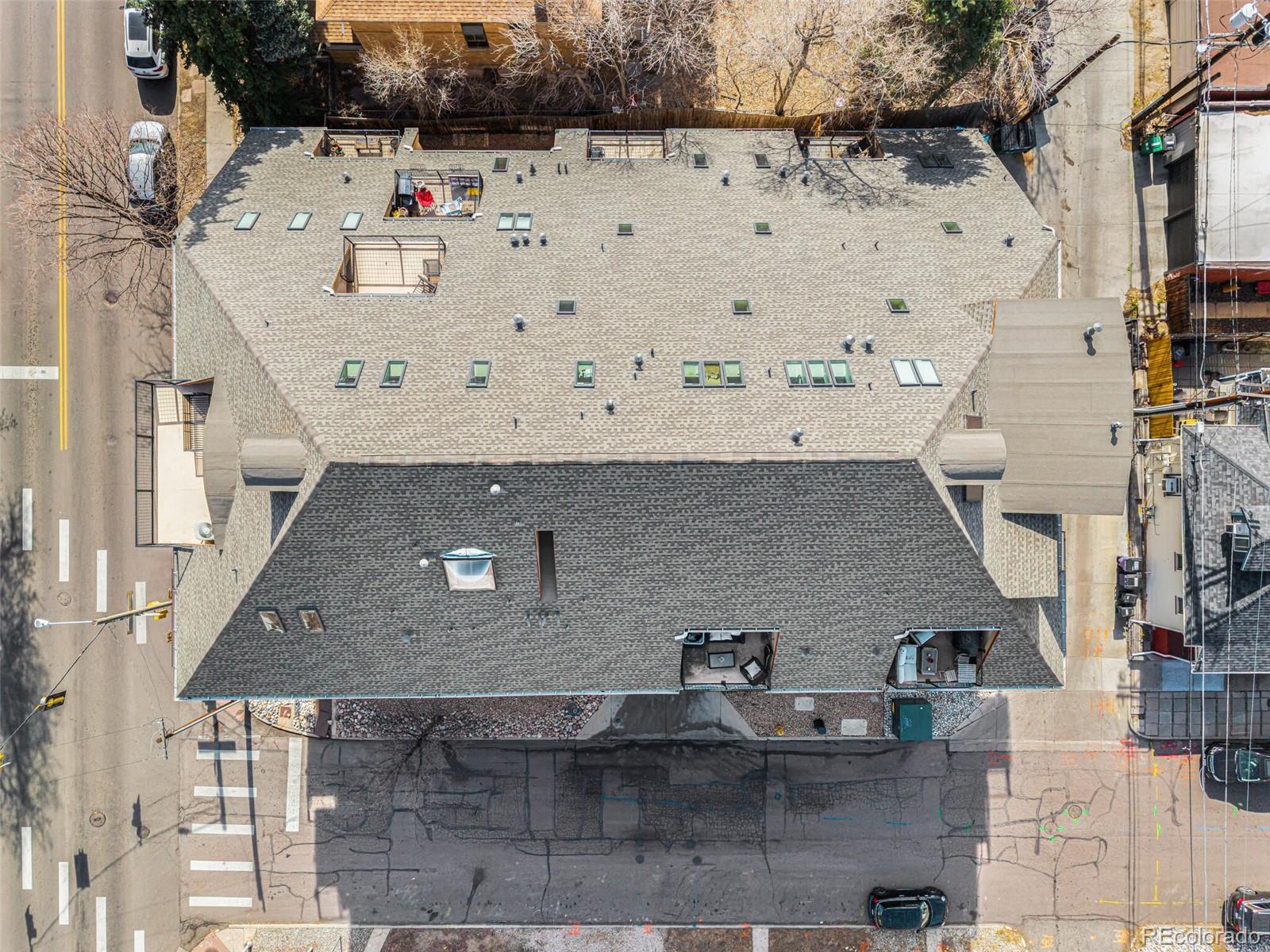 3299 Lowell Boulevard, Unit 302 Denver, CO 80211 - Photo 3 of 50 a aerial view of a white building with outdoor seating