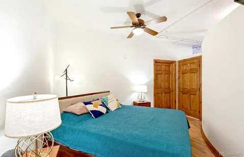a bedroom with a bed and a dresser