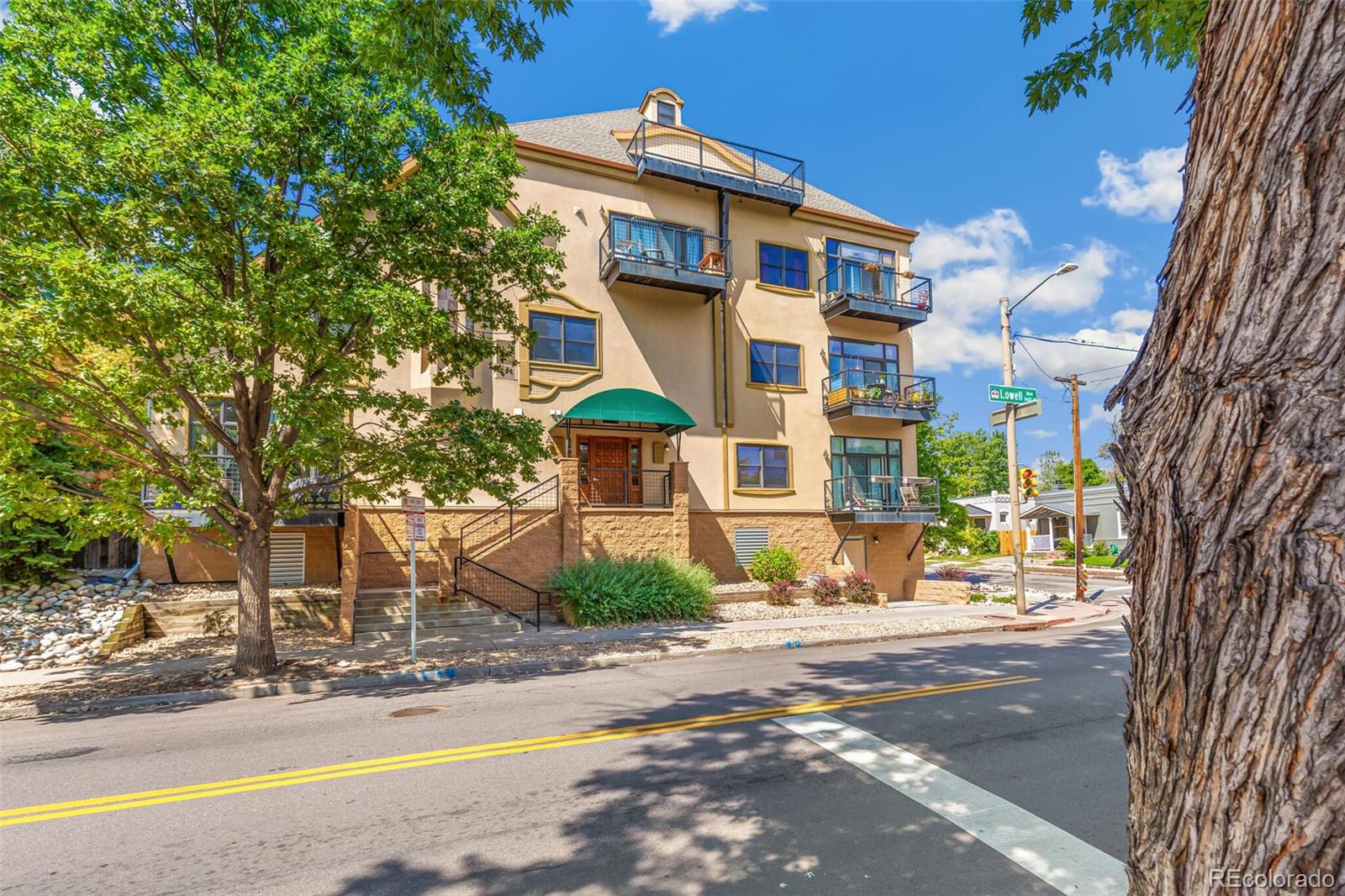 3299 Lowell Boulevard, Unit 302 Denver, CO 80211 - Photo 7 of 50 a view of a building with a street