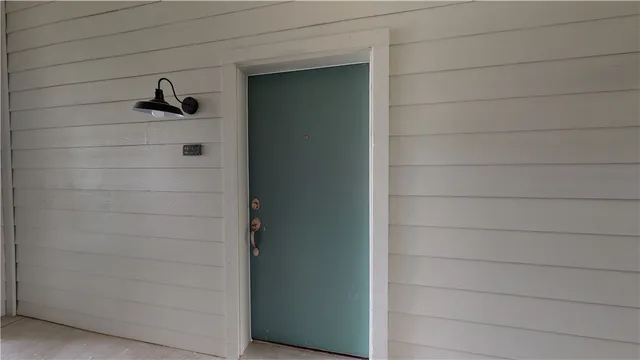 a kitchen with a chandelier and a sink