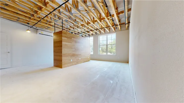 a view of an empty room with a windows