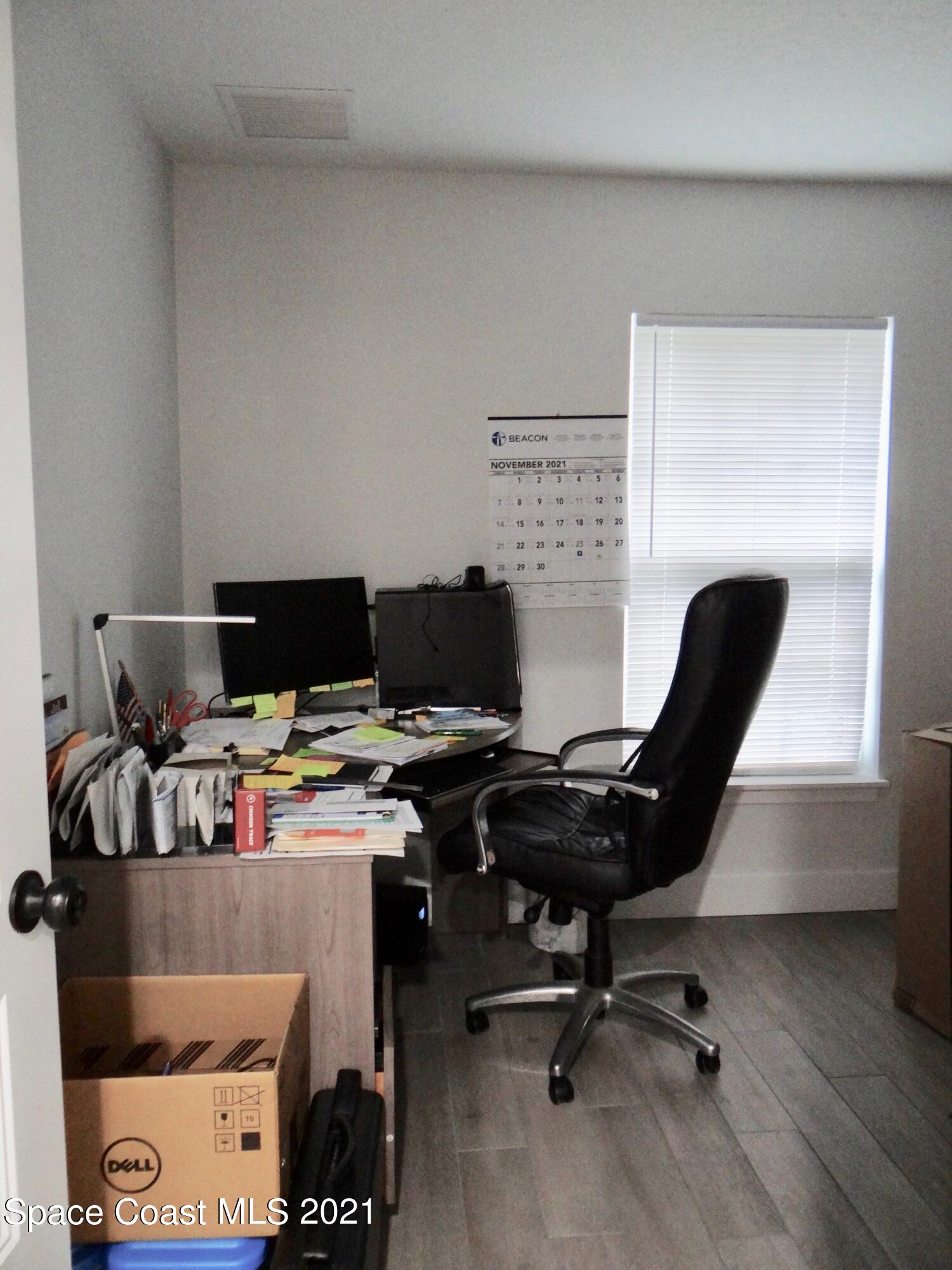 2725 Digby Road Southeast Palm Bay, FL 32909 - Photo 24 of 33 a view of a workspace with furniture and a window