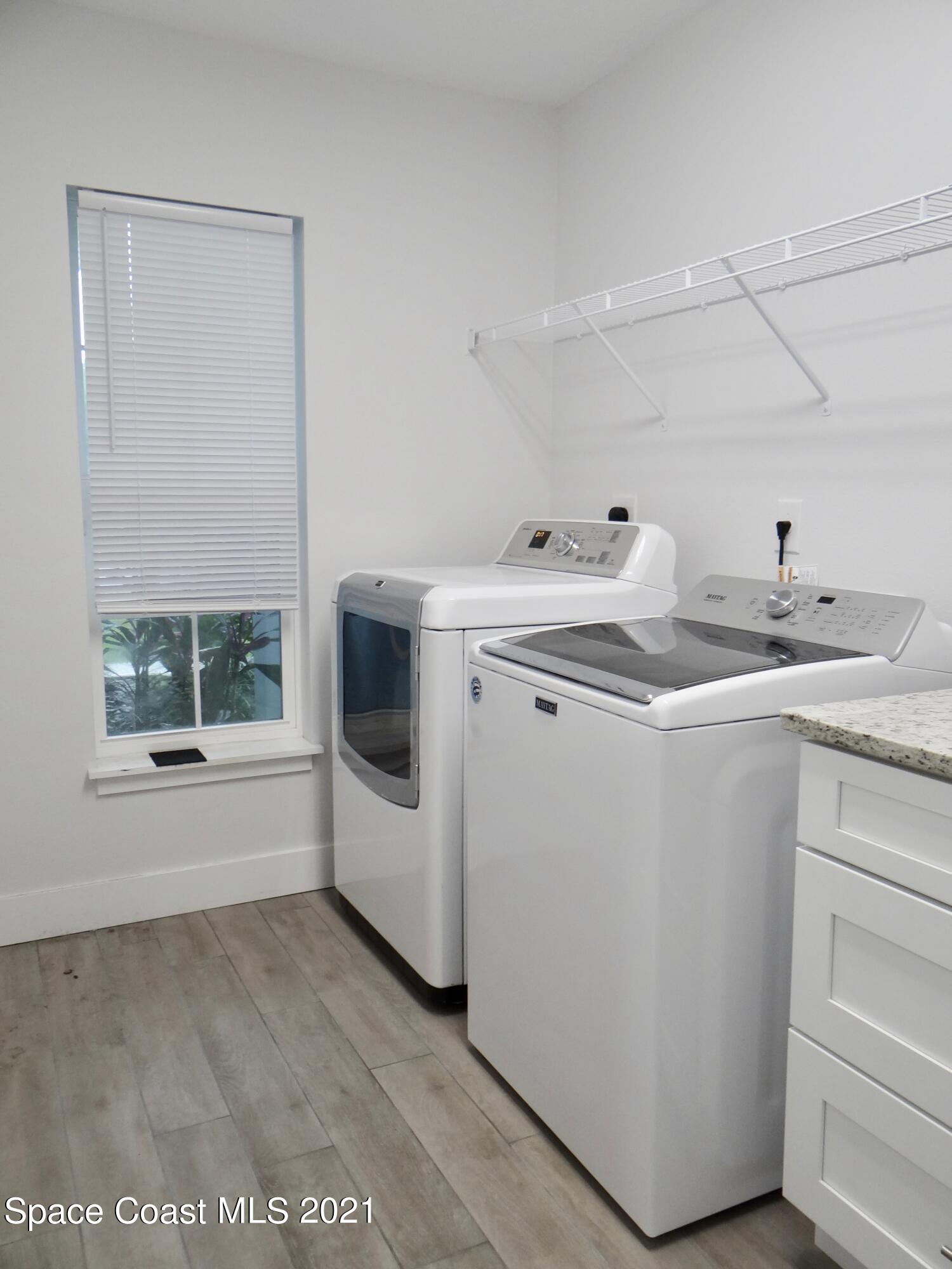 2725 Digby Road Southeast Palm Bay, FL 32909 - Photo 27 of 33 a utility room with washer and dryer