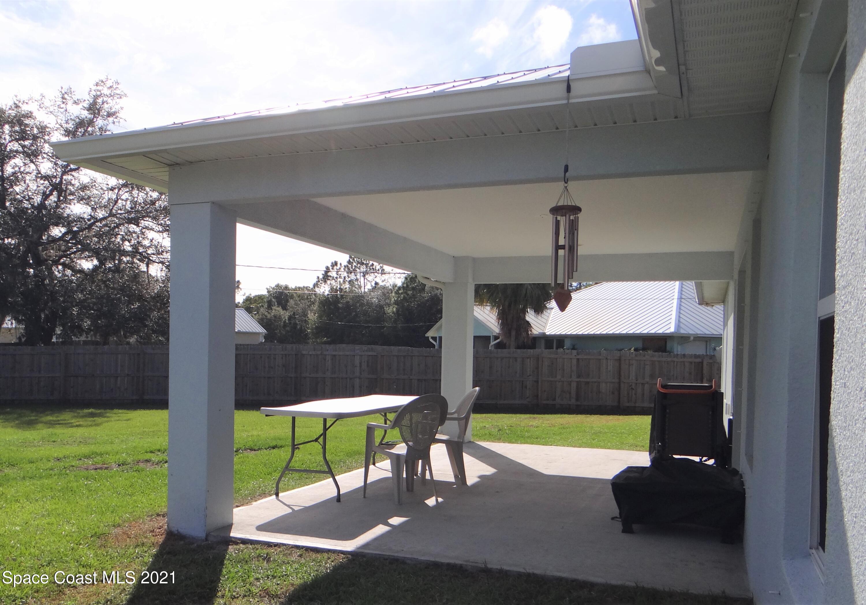 2725 Digby Road Southeast Palm Bay, FL 32909 - Photo 29 of 33 a view of a porch with furniture and a yard