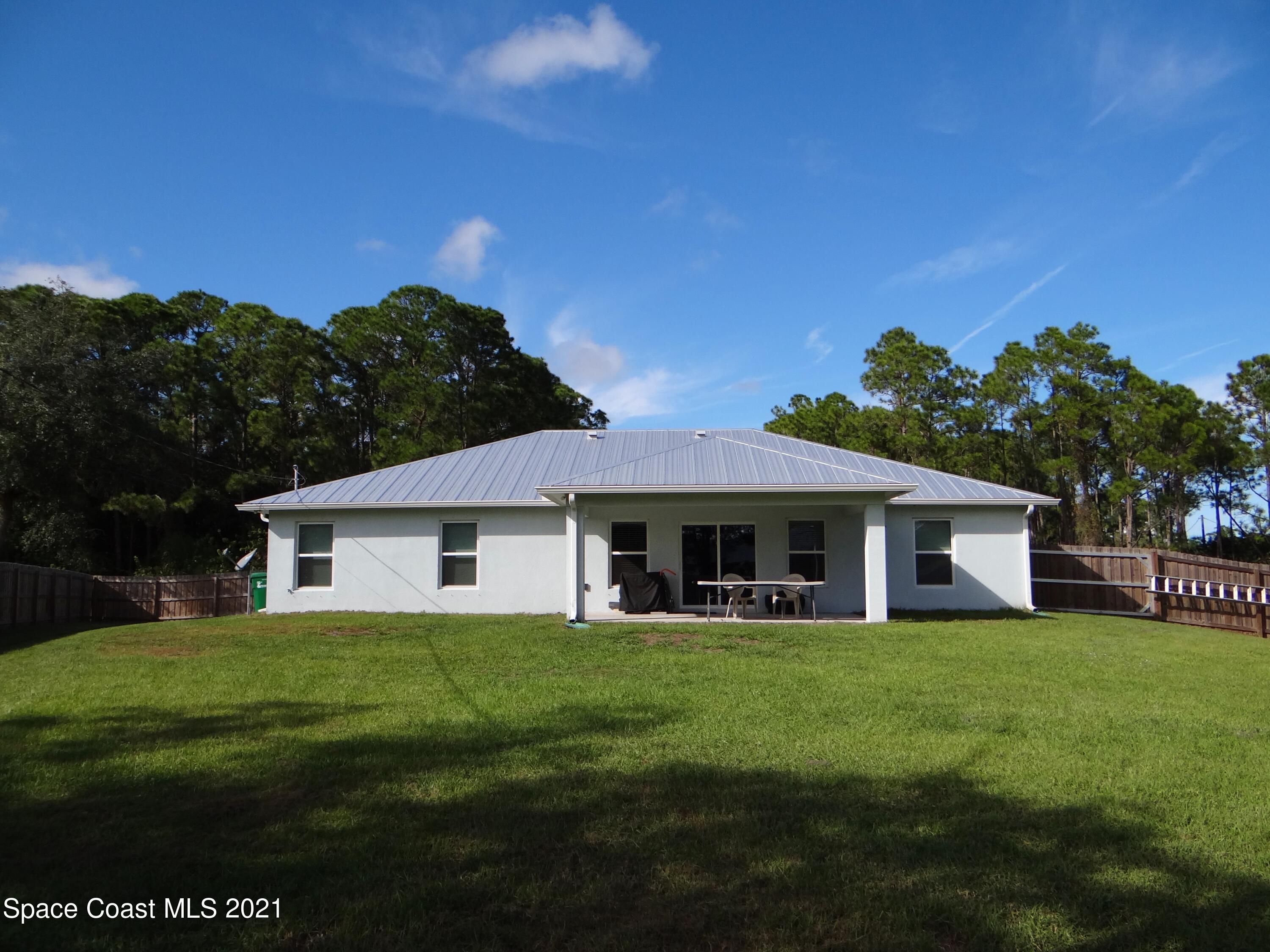2725 Digby Road Southeast Palm Bay, FL 32909 - Photo 31 of 33 a view of a house with a big yard