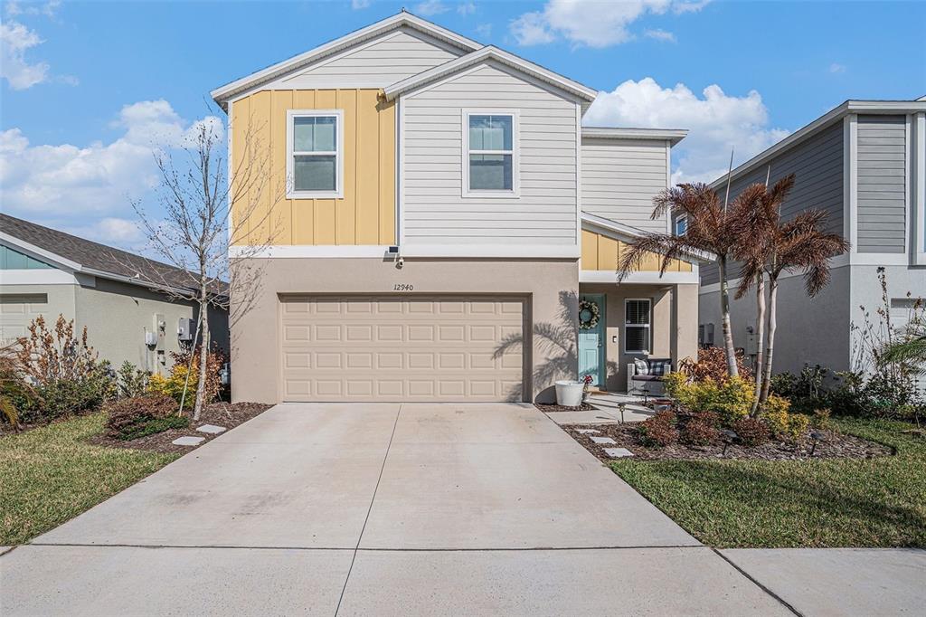 12940 Hawkstone Trail Boulevard Lithia, FL 33547 - Photo 1 of 33 a front view of house with yard and trees around