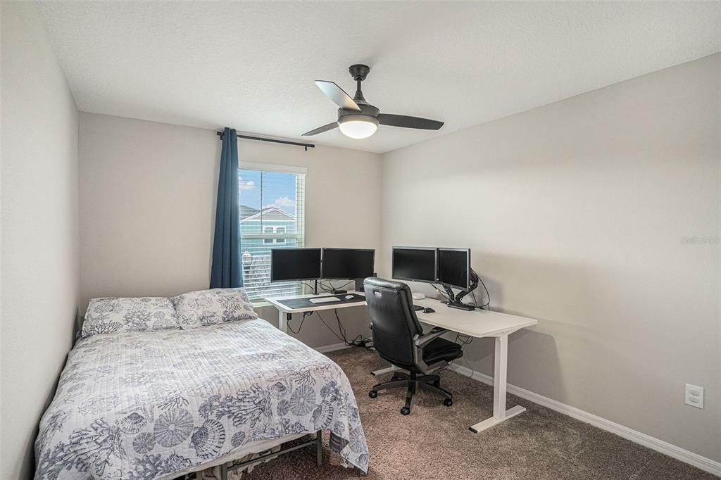 12940 Hawkstone Trail Boulevard Lithia, FL 33547 - Photo 16 of 33 a bedroom with a workspace