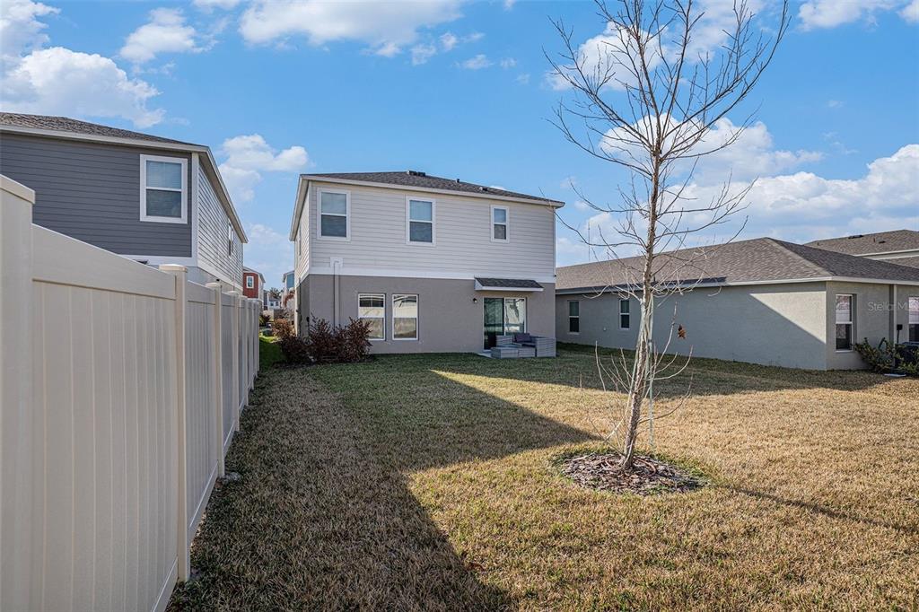 12940 Hawkstone Trail Boulevard Lithia, FL 33547 - Photo 22 of 33 a view of a house with a yard
