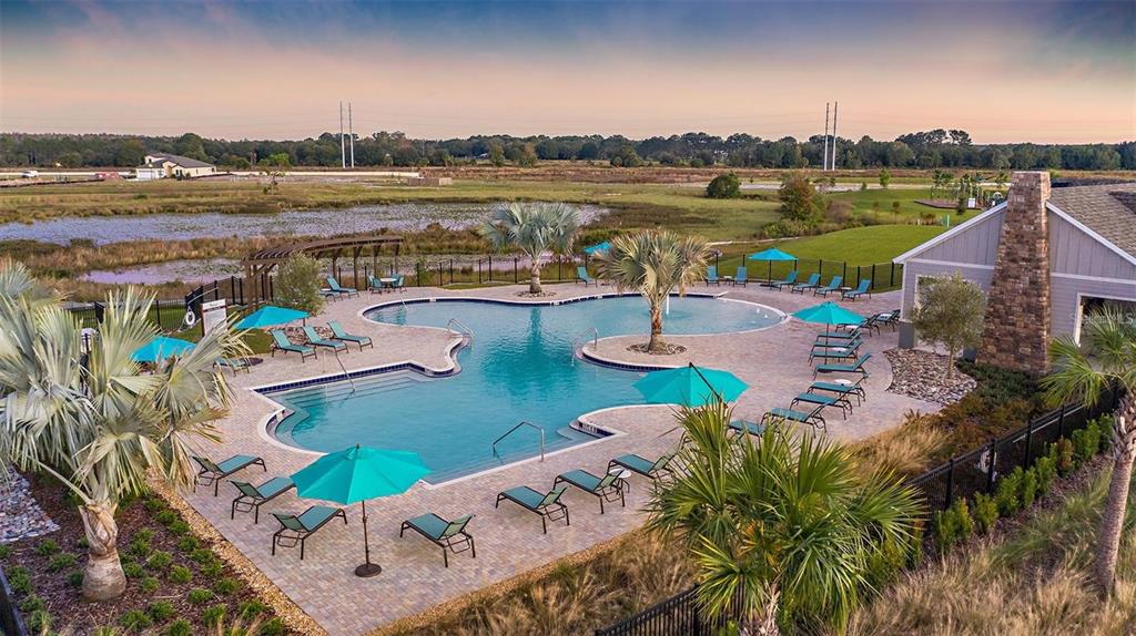 12940 Hawkstone Trail Boulevard Lithia, FL 33547 - Photo 25 of 33 a view of a lake with couches and city view