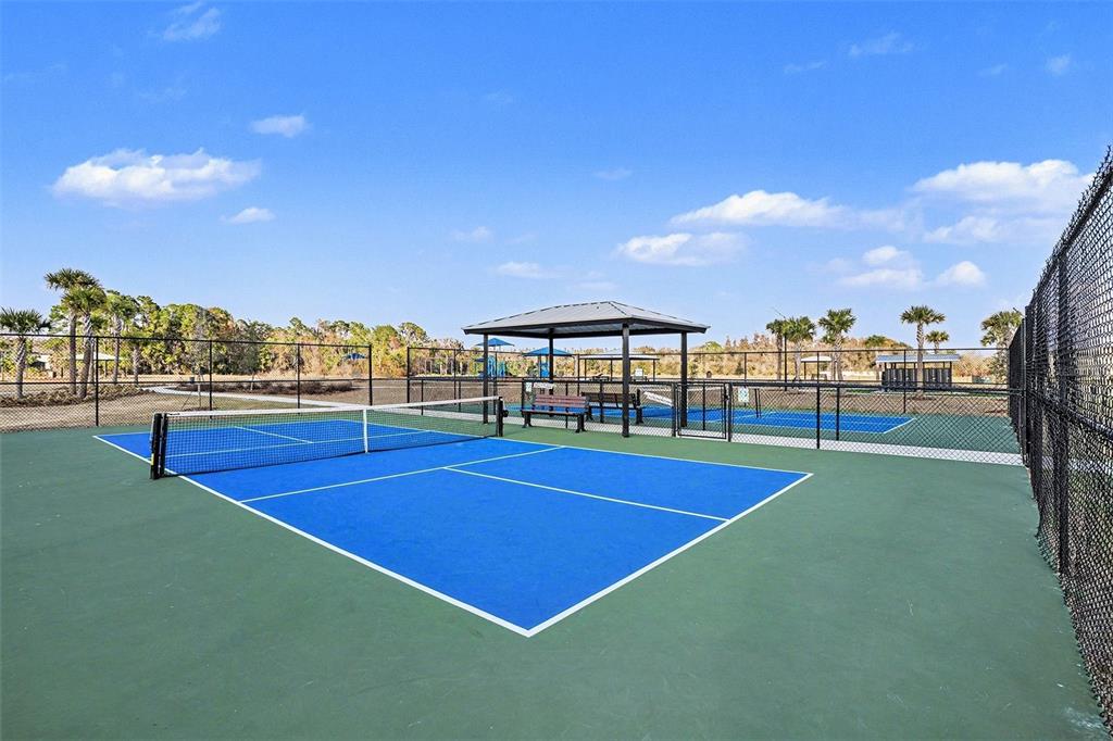 12940 Hawkstone Trail Boulevard Lithia, FL 33547 - Photo 28 of 33 a view of tennis court with chairs