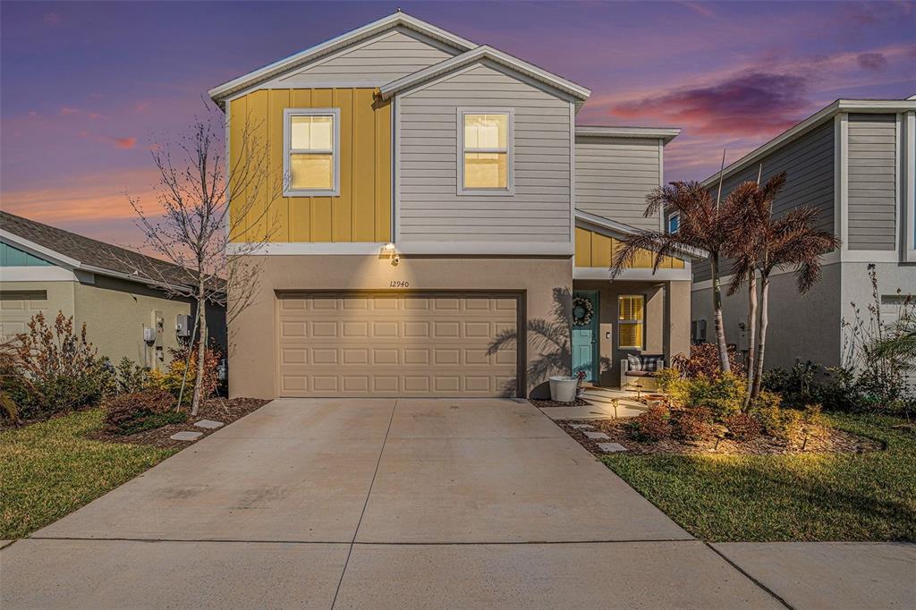 12940 Hawkstone Trail Boulevard Lithia, FL 33547 - Photo 33 of 33 a front view of a house with garden