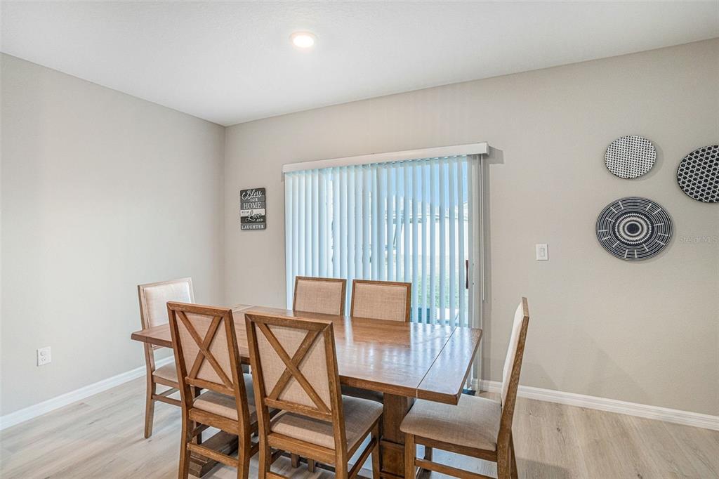 12940 Hawkstone Trail Boulevard Lithia, FL 33547 - Photo 8 of 33 a view of a room with furniture and wooden floor