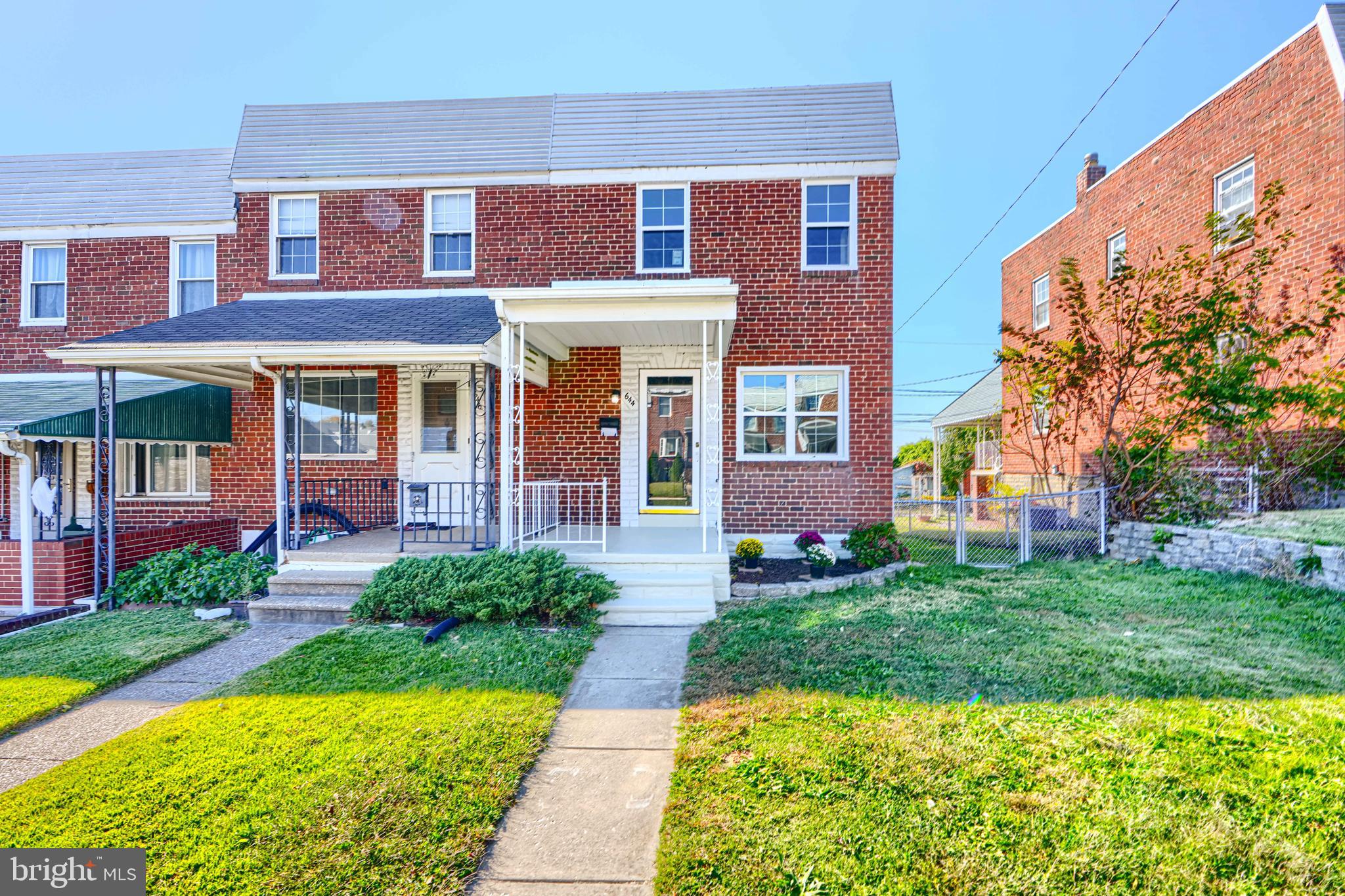 644 48th Street Baltimore, MD 21224 - Photo 1 of 37 a front view of a house with garden