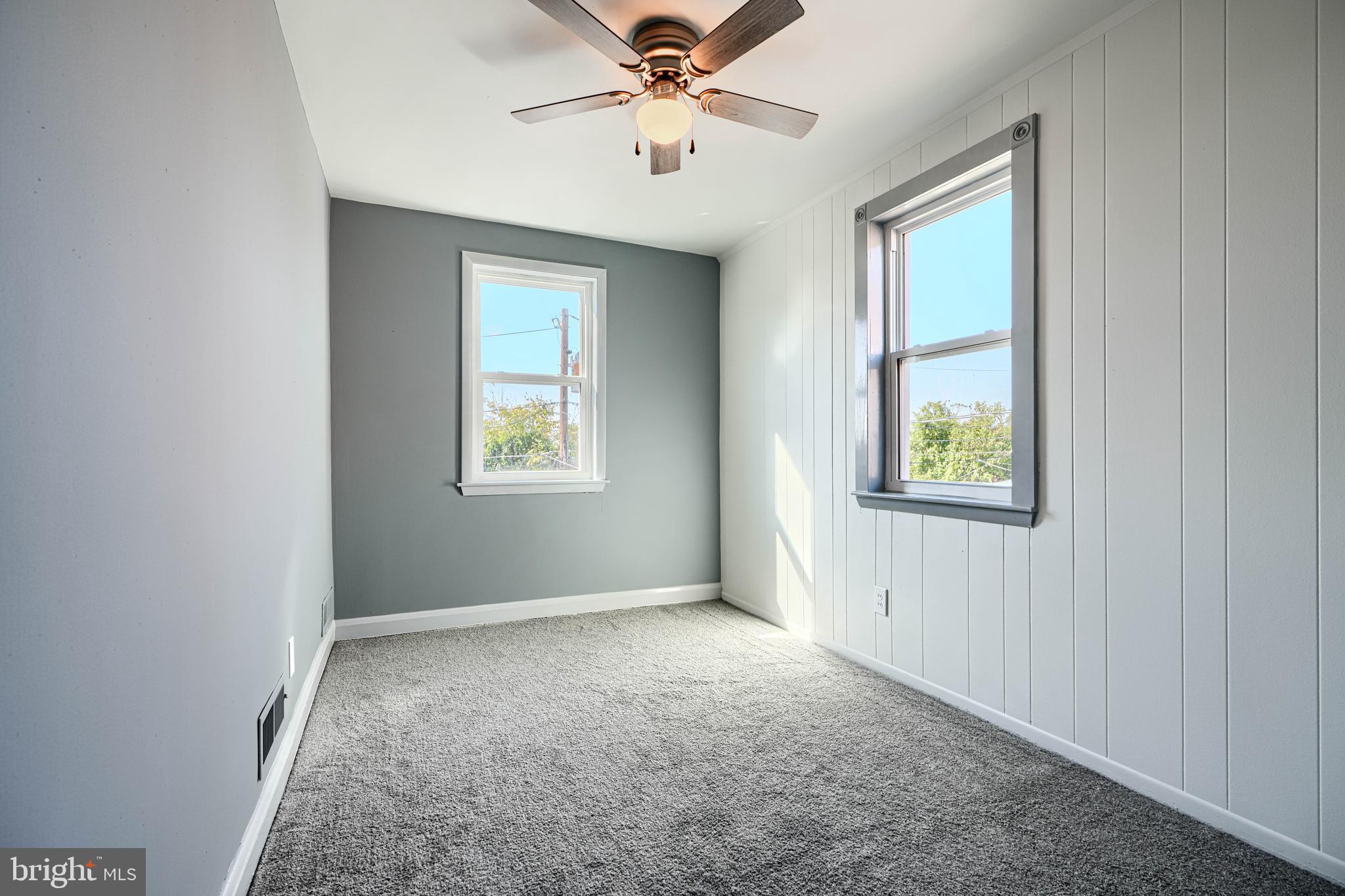 644 48th Street Baltimore, MD 21224 - Photo 21 of 37 an empty room with windows and fan