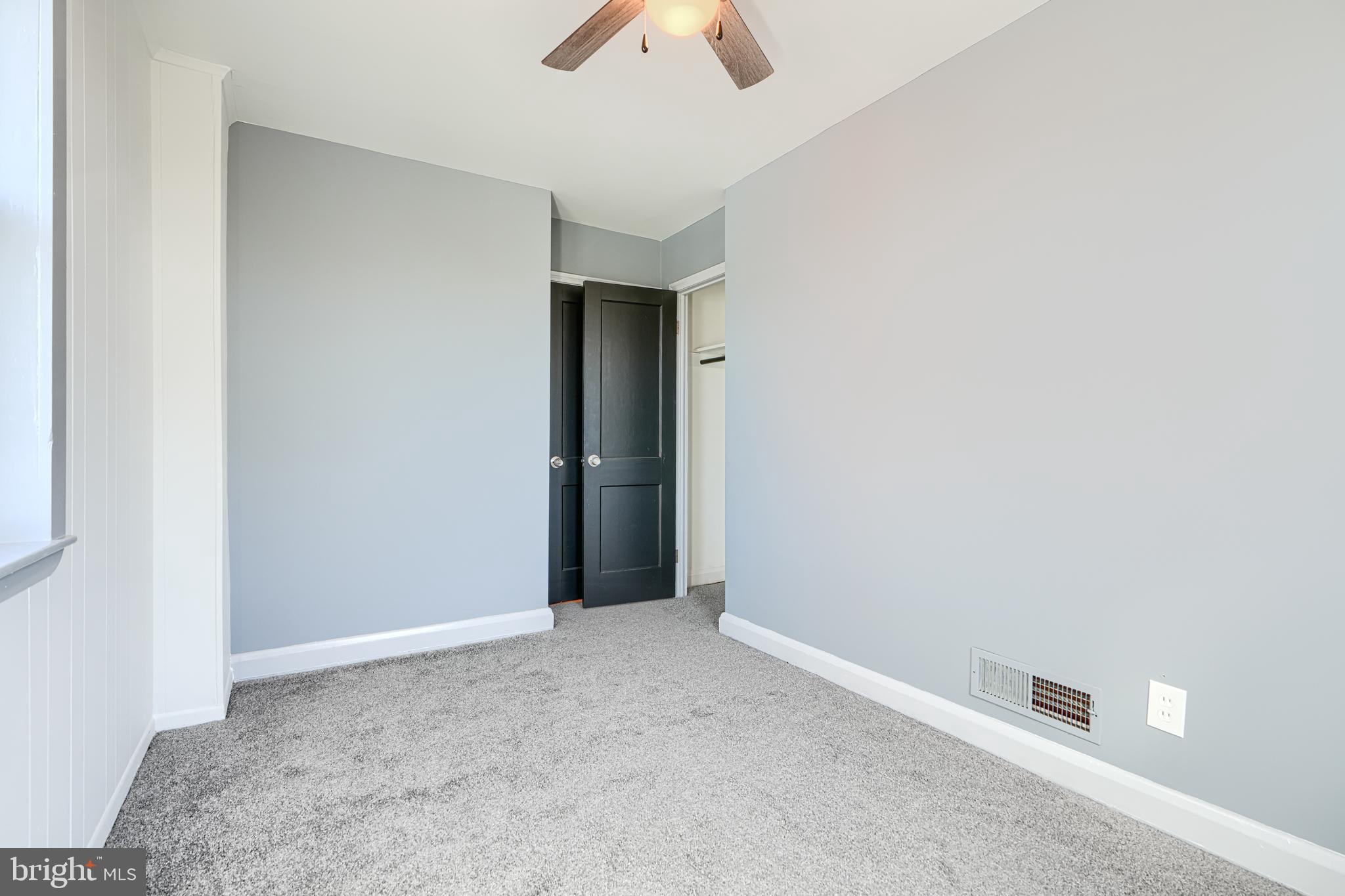 644 48th Street Baltimore, MD 21224 - Photo 23 of 37 an empty room with closet and chandelier fan