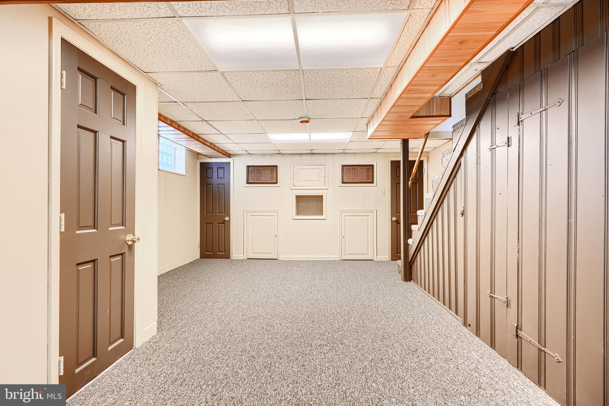644 48th Street Baltimore, MD 21224 - Photo 29 of 37 a view of a hallway with wooden floor and staircase