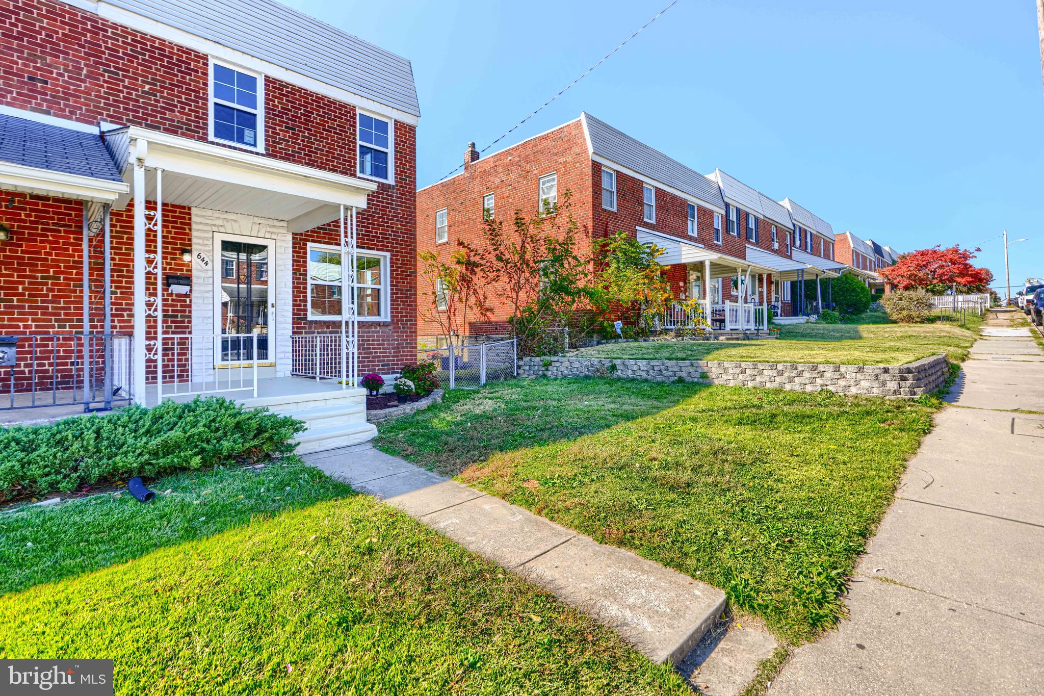 644 48th Street Baltimore, MD 21224 - Photo 3 of 37 a front view of a house with a yard