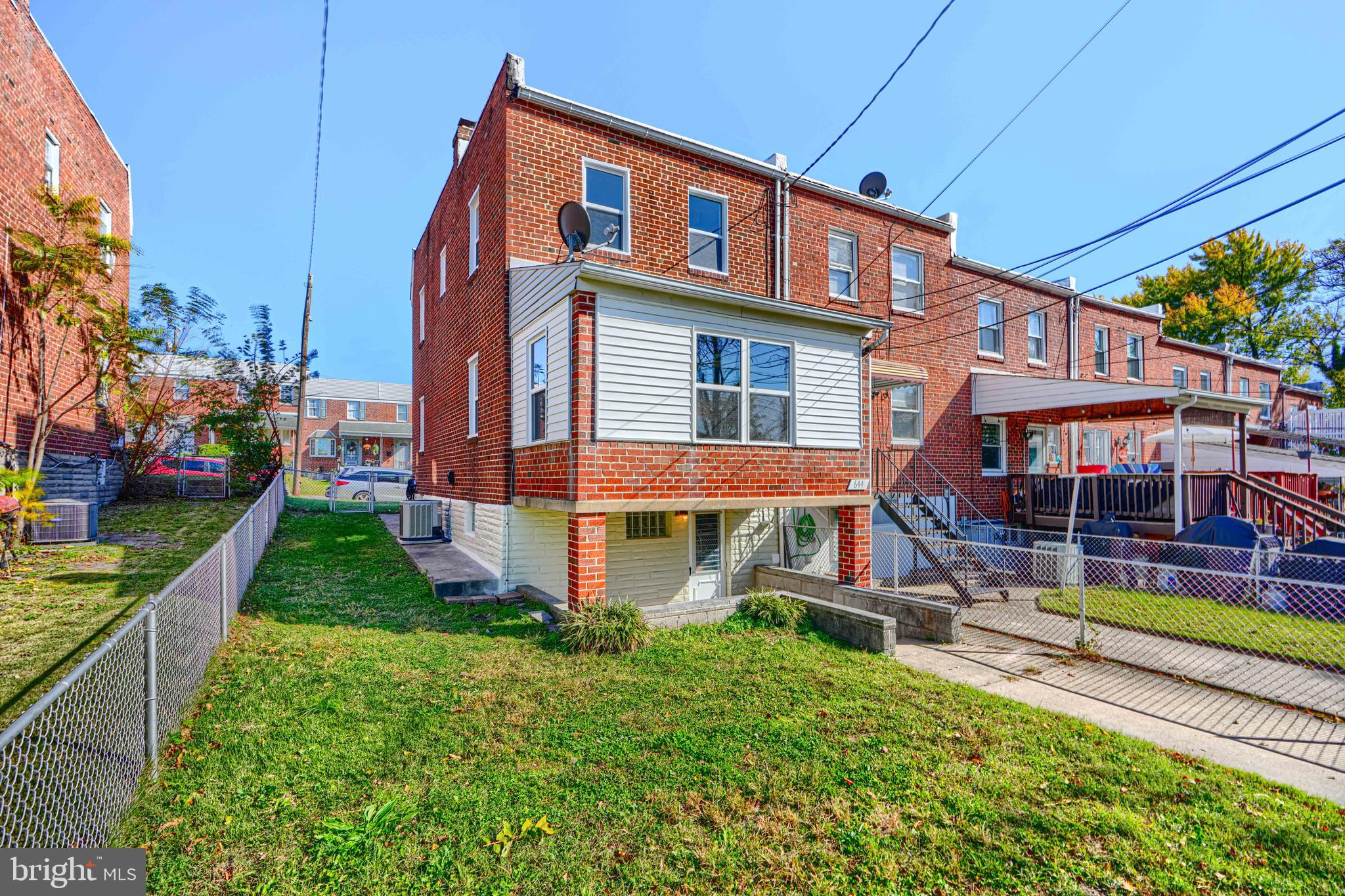 644 48th Street Baltimore, MD 21224 - Photo 34 of 37 a front view of a house with a yard table and chairs