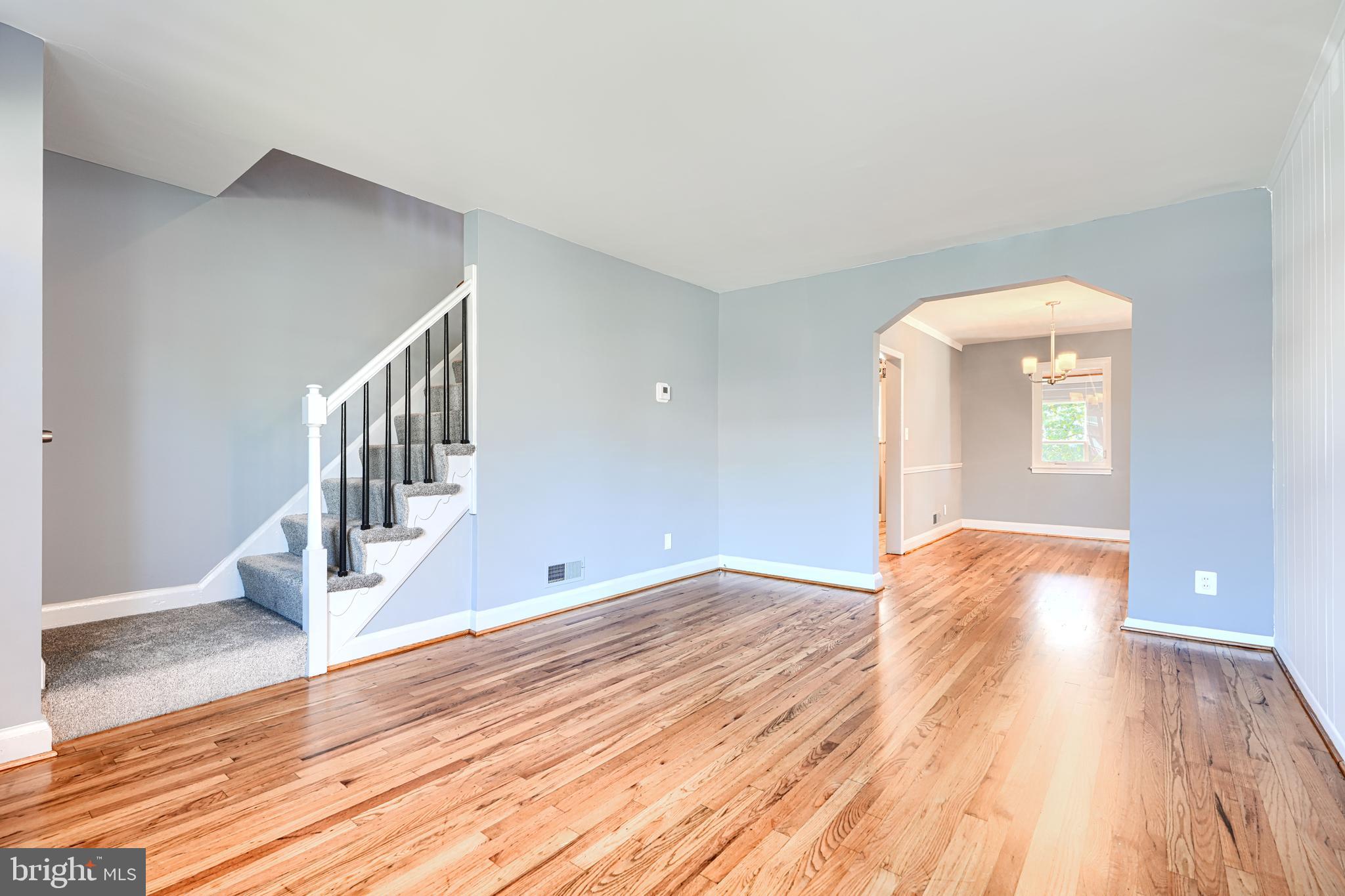 644 48th Street Baltimore, MD 21224 - Photo 6 of 37 a view of empty room with wooden floor and fan