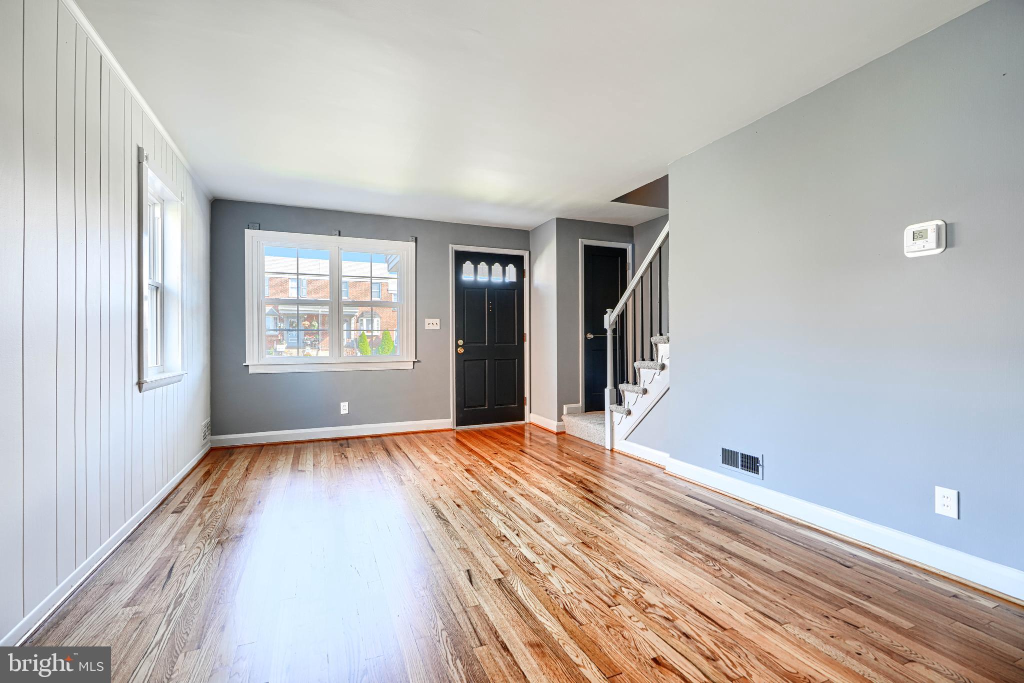 644 48th Street Baltimore, MD 21224 - Photo 7 of 37 a view of an empty room with wooden floor and a window