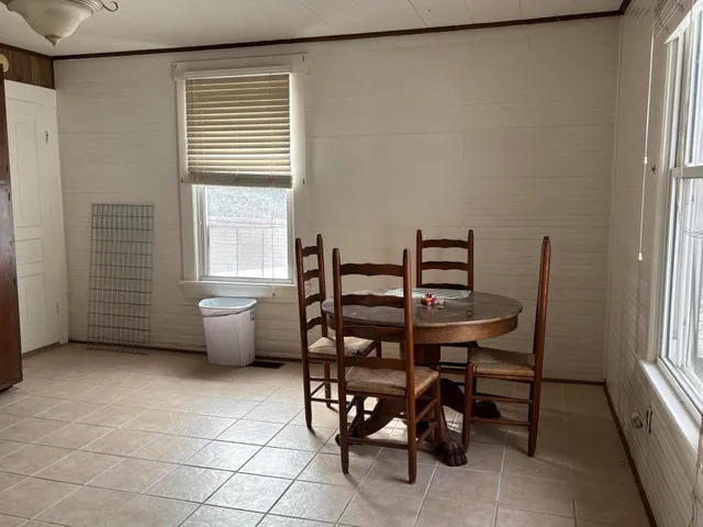 a view of a livingroom with furniture and window