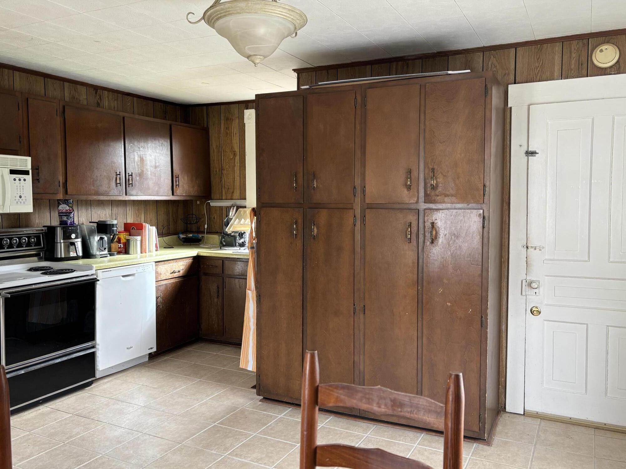 165 West College Street Rocky Mount, VA 24151 - Photo 13 of 24 a kitchen with a refrigerator a stove and a cabinets