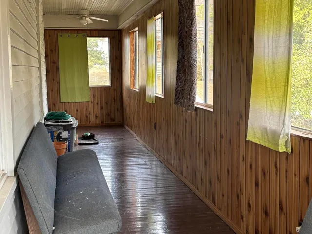 a view of furniture and window in back of house