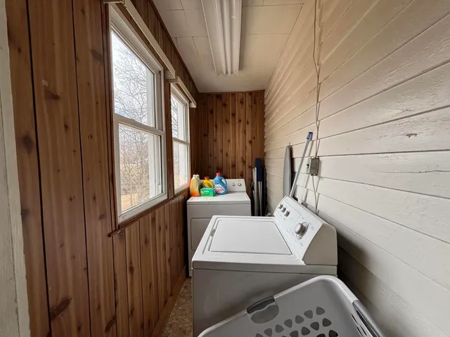 a bathroom with a sink toilet vanity and tub