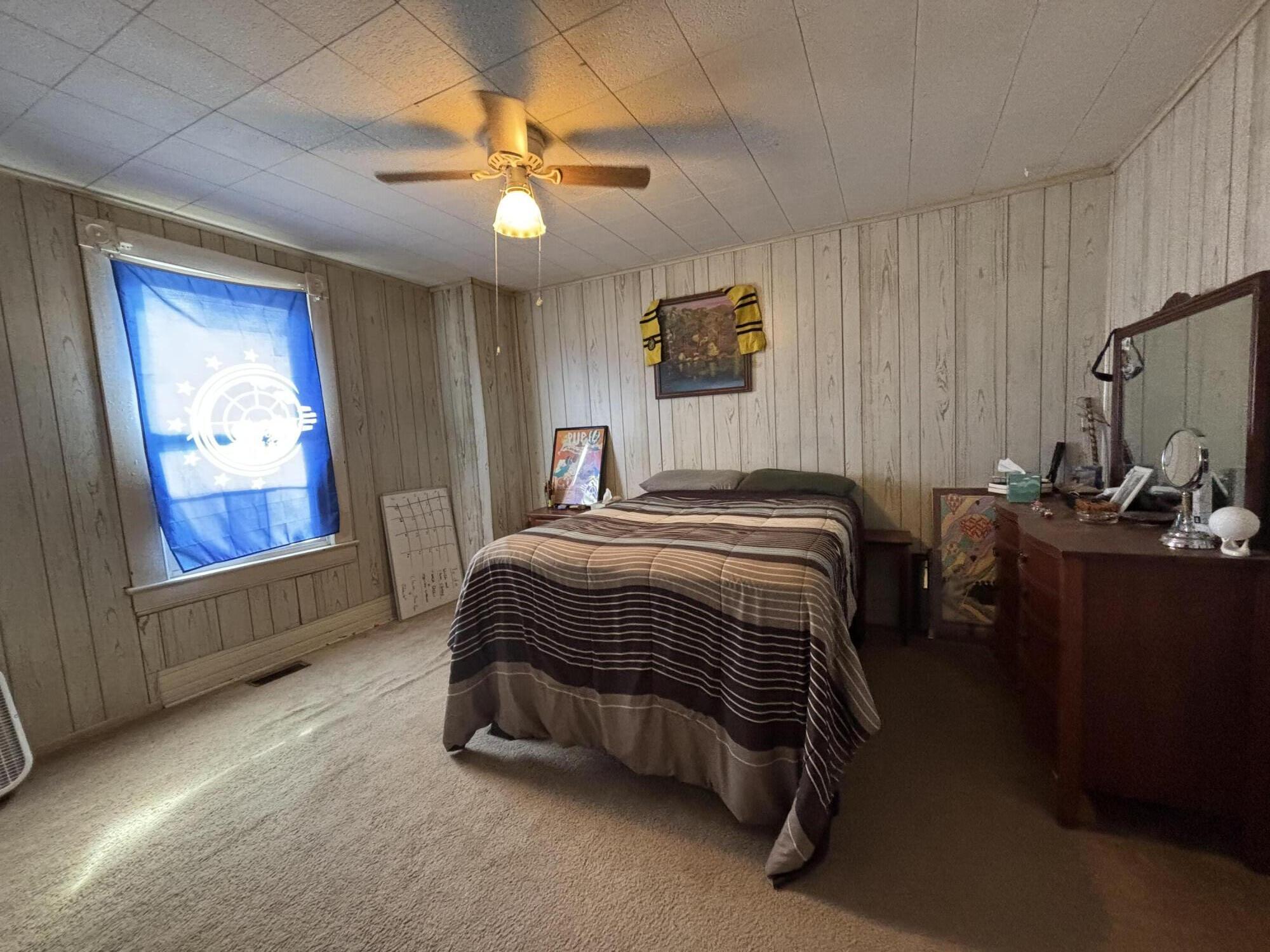 165 West College Street Rocky Mount, VA 24151 - Photo 17 of 24 a bedroom with a bed and a painting on the wall