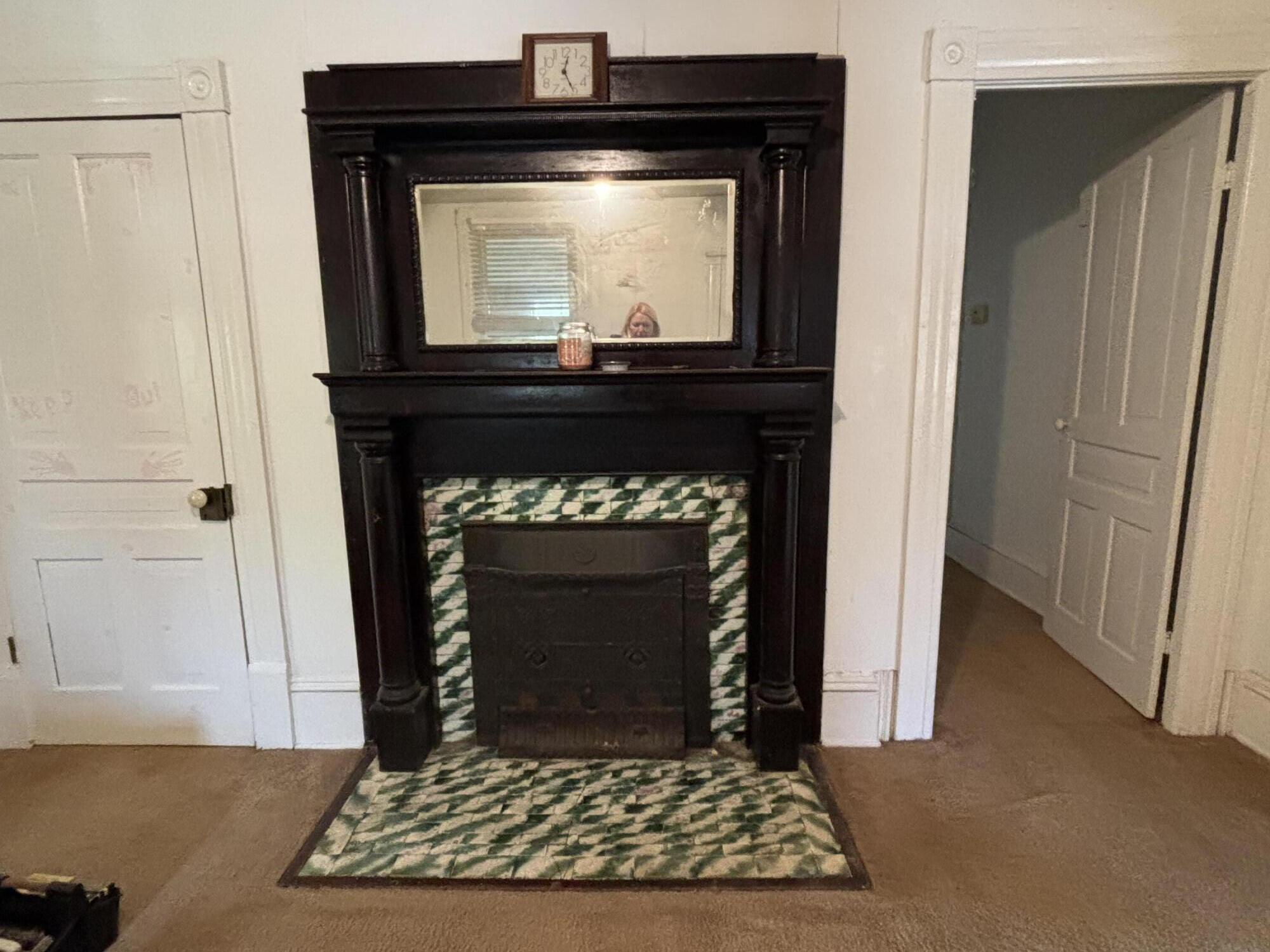 165 West College Street Rocky Mount, VA 24151 - Photo 20 of 24 a living room with a fireplace and a wooden floor