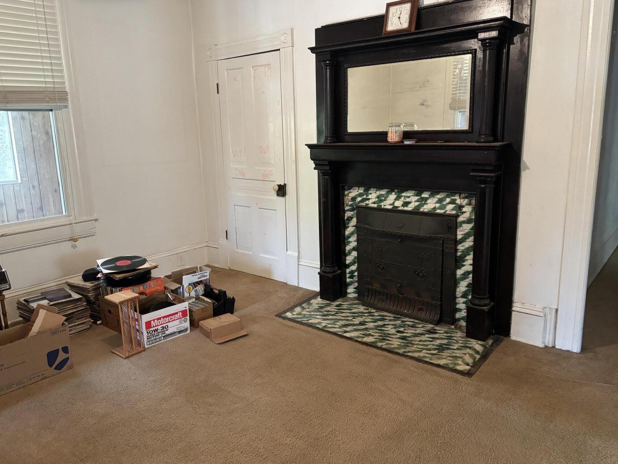 165 West College Street Rocky Mount, VA 24151 - Photo 21 of 24 a living room with furniture a flat screen tv and a fireplace