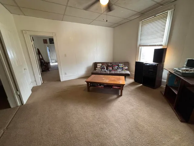 a kitchen with a refrigerator a stove top oven a sink and cabinets