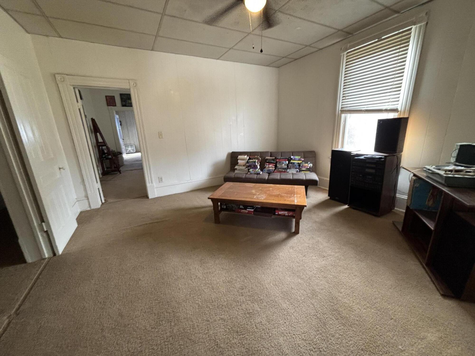 165 West College Street Rocky Mount, VA 24151 - Photo 9 of 24 a living room with furniture and a dresser