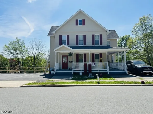 front view of a house with a swimming pool