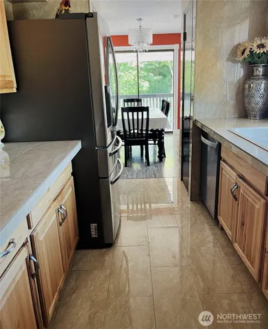 a view of a kitchen with furniture and a kitchen