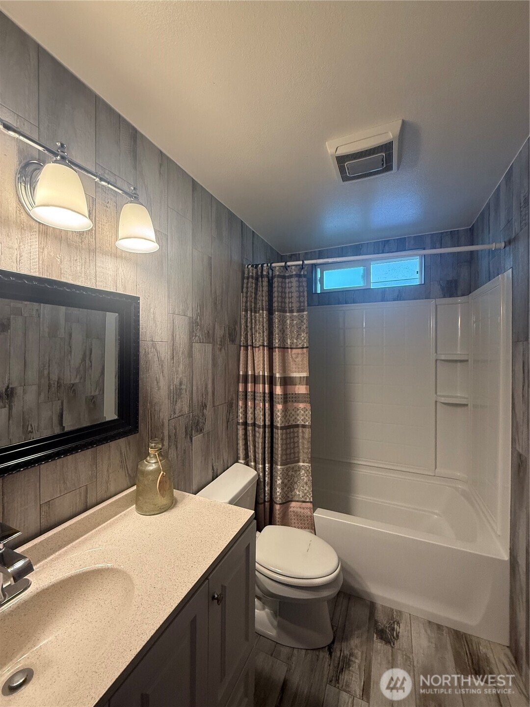 1017 Ballentine Street Raymond, WA 98577 - Photo 19 of 33 a bathroom with a sink a toilet and shower