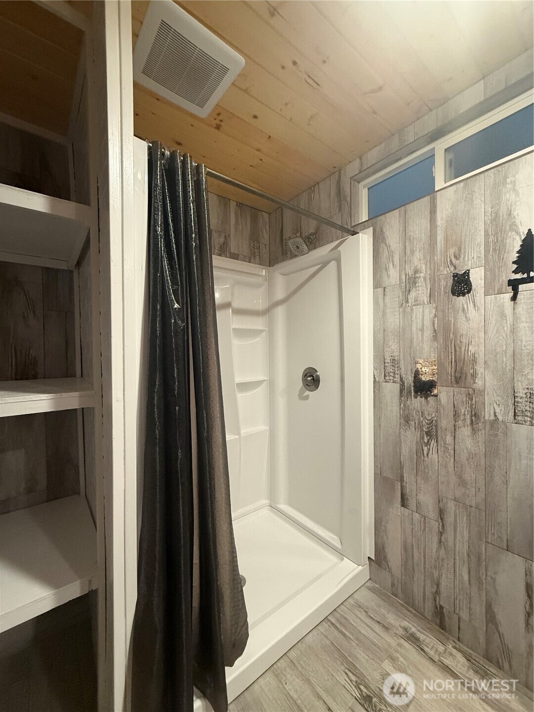 1017 Ballentine Street Raymond, WA 98577 - Photo 21 of 33 a bathroom with a shower and a glass door