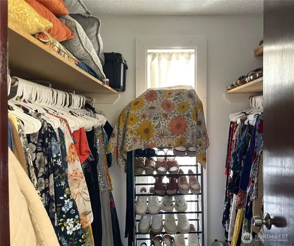 a bathroom with a toilet a sink and a mirror