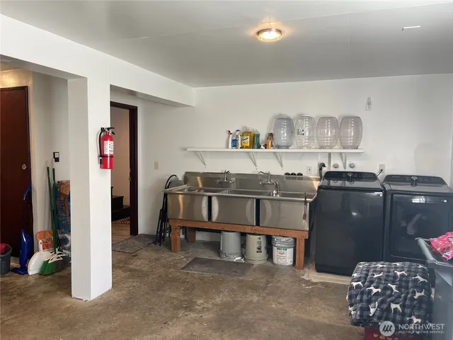 a kitchen with a table and chairs in it