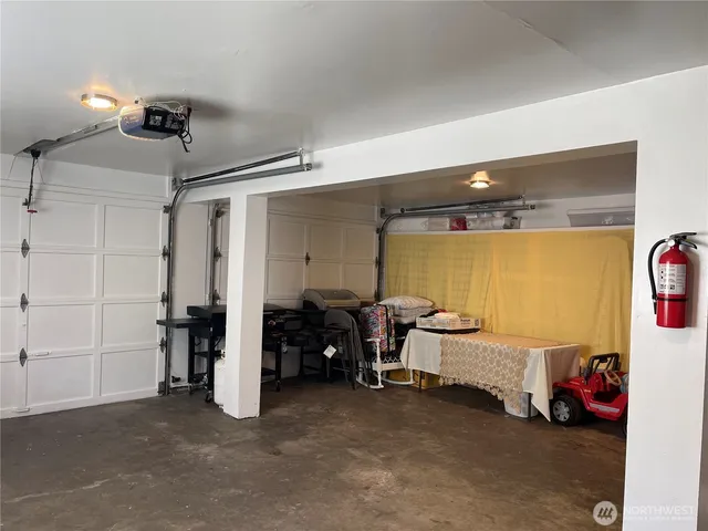 a kitchen with stainless steel appliances a refrigerator and a stove top oven