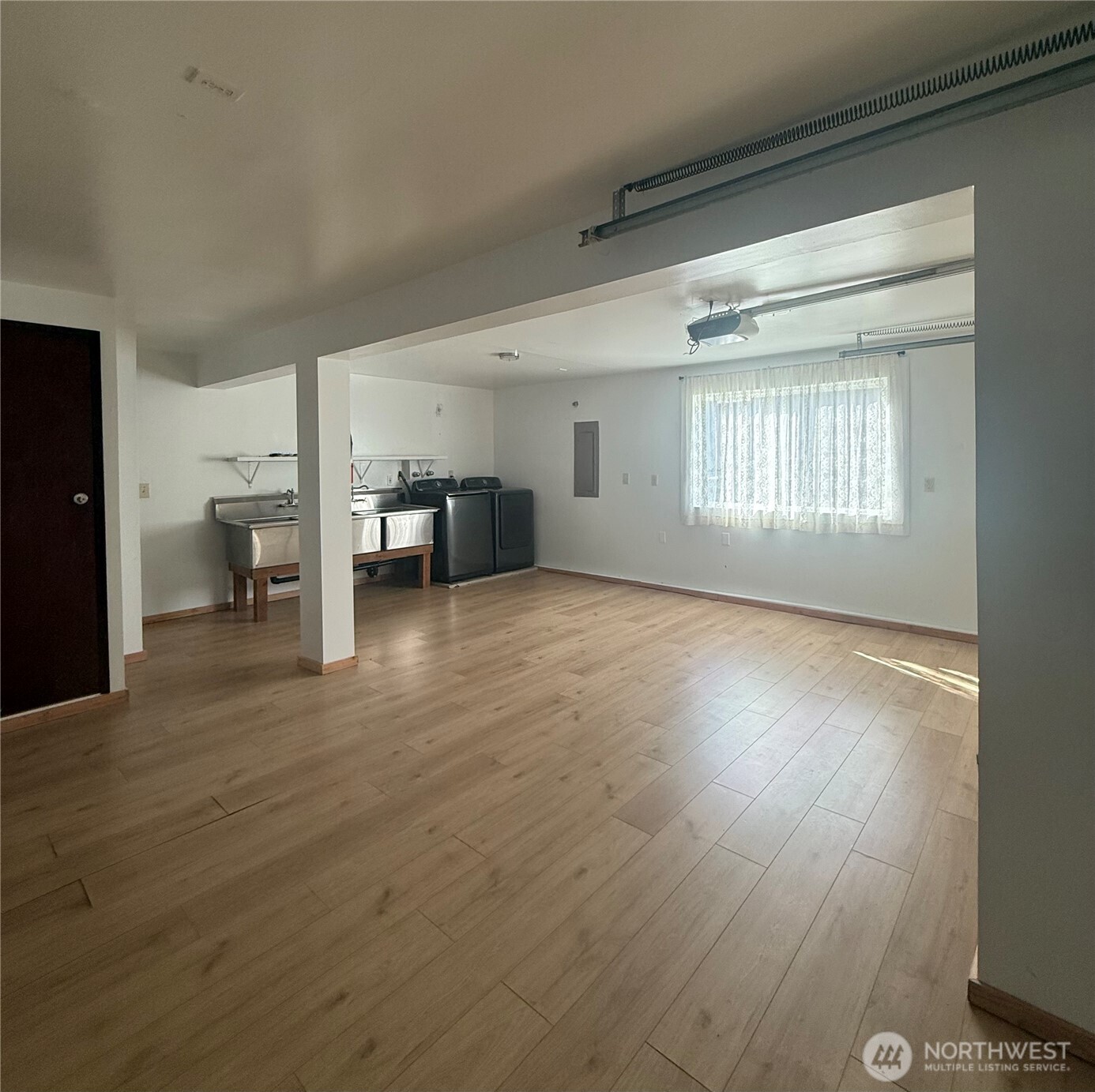 1017 Ballentine Street Raymond, WA 98577 - Photo 30 of 33 wooden floor in an empty room with a window