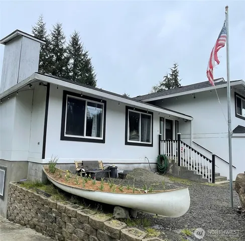 a view of a patio with table and chairs