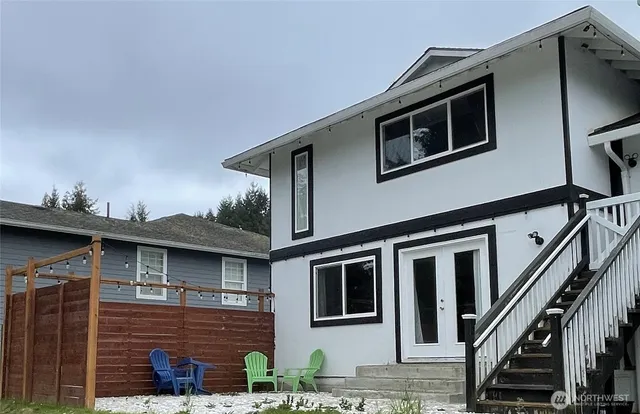 a front view of a house with stairs