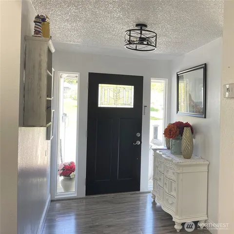 a room that has a window and wooden floor